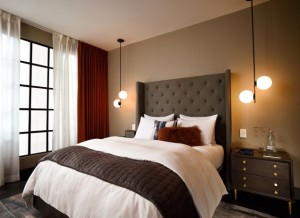 A rendering of a bedroom in a West Elm hotel.